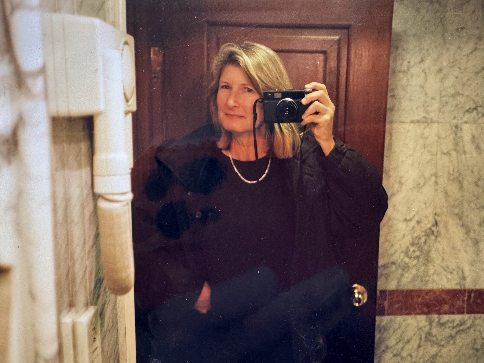 Mirror self-portrait with camera